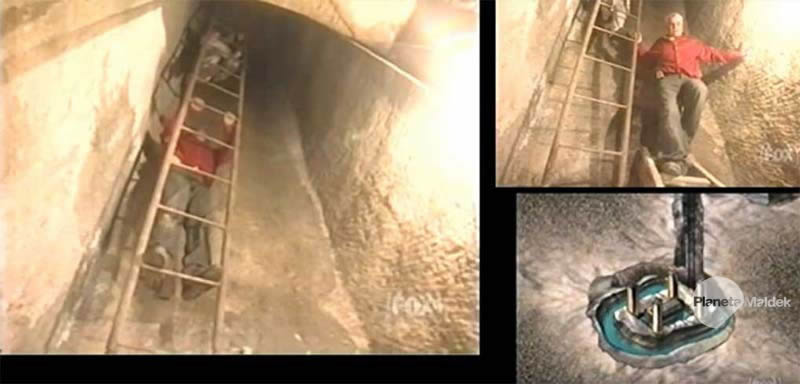 Zawi Hawass bajando hacia una cámara subterránea llena de agua y con un sarcófago ahí